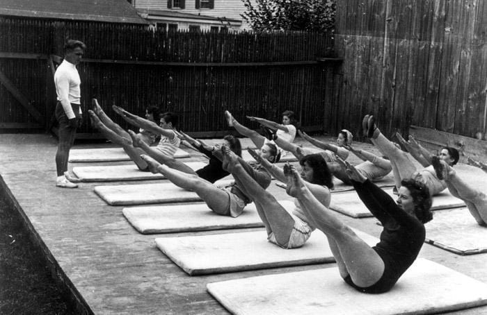 Joseph Pilates leading a group through his Mat system of exercises